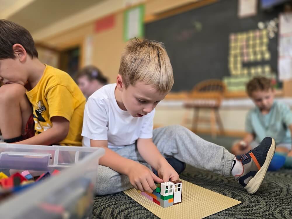 boy building with legos