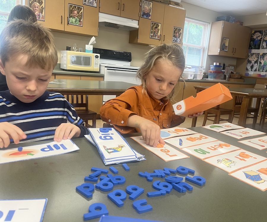kids playing with letters